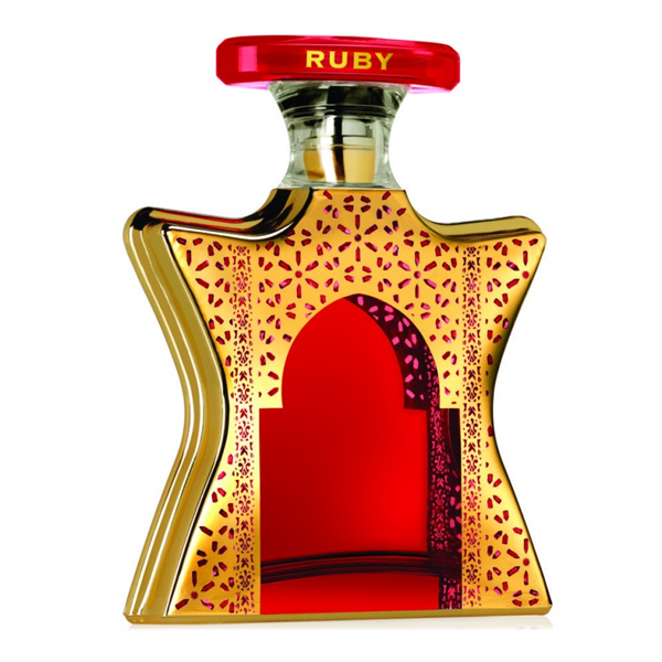 Bond No. 9 Dubai Ruby 3.4 EDP Unisex Perfume by Bond No. 9 Perfumes features a gold and red star-shaped bottle with intricate patterns and an arched window, topped with a red cap inscribed “RUBY” in gold, capturing Arabian elegance.