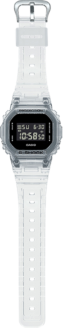 The G-Shock DW-5600SKE-7 Standard Digital Unisex Watch by G-Shock Watches features a clear resin strap and casing, a rectangular digital display showing time, day, and date in white on black, combining durability with modern style.