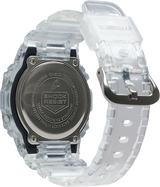 A close-up of the G-Shock Watches DW-5600SKE-7 Standard Digital Unisex Watch shows its clear resin strap and stainless steel case back engraved with model details and "Shock Resist.