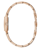 A slim Guess GW0249L3 Bella Rose Gold Stainless Steel Bangle women's watch by Guess Watches, shown sideways to highlight its elegant oval metal band and refined style against a white background.