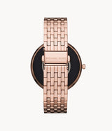 The Michael Kors MKT5128 Darci Gen 5E rose gold smartwatch features a stainless steel linked bracelet with MICHAEL KORS engraved on the clasp and the Gen 5E display partially visible from the back.