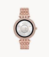 The Michael Kors Watches MKT5128 Darci Gen 5E features a round rose gold face, crystal-set bezel, metal link strap, and displays time, date, battery level, and more. This women’s smartwatch pairs style with smart functionality.