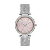 The Michael Kors MK4518 Darci Women’s Watch features a stainless steel mesh strap, round pink mother-of-pearl dial, crystal-trimmed bezel, and sleek silver markers—an elegant timepiece by Michael Kors Watches for women.