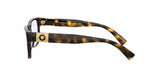 Side view of Versace VE3295 108 54 unisex optical frame in brown tortoiseshell with thick arms, a gold rectangular accent and Medusa logo at the hinge. The Versace Sunglasses brand name appears inside the arm.