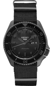 The Seiko SRPD79 Automatic Black Nylon Strap Men Watch by Seiko Watches features a black dial with white markers, day/date display, rotating bezel, and large arrow hour hand for added style and function.