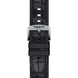Close-up of the Tissot T1154071705100 T-Race Swissmatic men’s watch: black leather strap with a crocodile pattern and a silver, Tissot-engraved buckle, set against a white background. Brand: Tissot Watches.