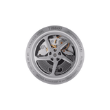 Close-up of the Tissot T1154272703100 T-RACE AUTOMATIC CHRONOGRAPH’s transparent case back by Tissot Watches, displaying motorbike-inspired gears and edge engravings for stainless steel, sapphire crystal, water resistance, and model number.