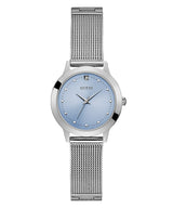 The Guess U1197L2 Chelsea by Guess Watches features a silver stainless steel mesh strap, light blue round dial, minimalist design with dot hour markers, subtle diamond accents, and the GUESS logo for a sleek, modern women’s watch.