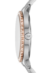 Side view of the Michael Kors MK6849 Layton women's watch featuring a silver-tone stainless steel strap, rose gold ridged bezel, and an MK-engraved crown. This elegant timepiece is from Michael Kors Watches.