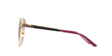 Side view of Gucci GG0807SA 002 Women Sunglasses with bold square frames, gold accents, and black-burgundy arms featuring the gold Gucci logo. These chic Gucci Sunglasses offer 100% UV protection against a white background.
