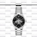 The Gucci YA1264136 G-Timeless Unisex Watch by Gucci Watches features a silver design with a black dial, accented by a large bee, stars, a heart, and repeating LEXOR MIAMI logos—channeling the iconic G-Timeless style.