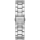 A close-up of the Guess Watches GW0026L1 Chateau silver stainless steel women’s watch band, featuring a polished segmented link design and a clasp engraved with GUESS at the center.