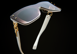 The Balmain BPS-106B-150 Armour Unisex Sunglasses by Balmain Sunglasses feature a stylish design with a white strap.