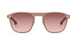 A close-up of Ic Berlin Sunglasses: the Herzberge Grid unisex sunglasses in shiny copper with a stylish browline design.